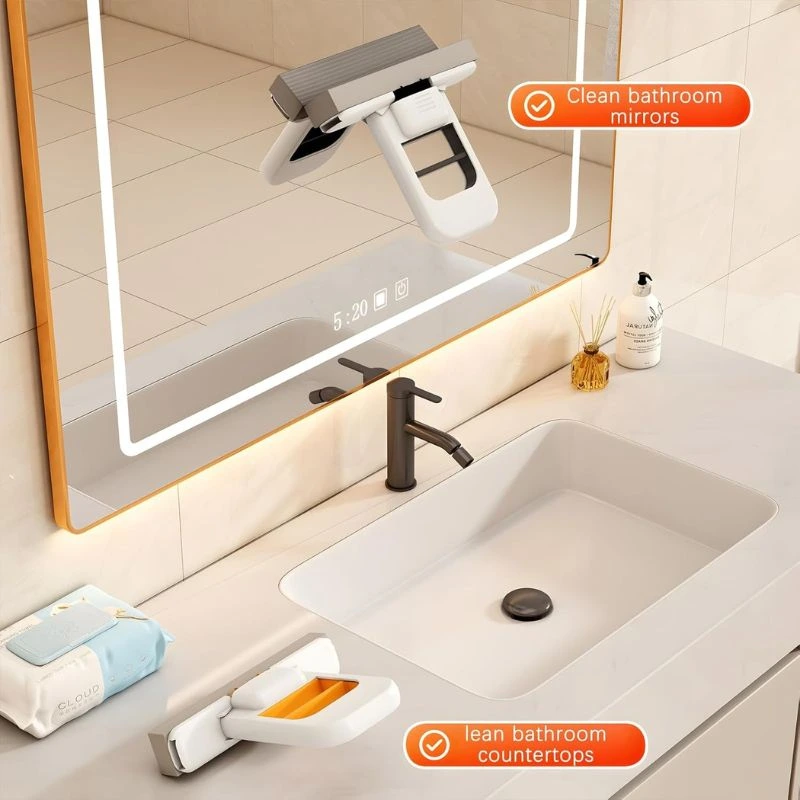 Foldable mini sponge mop shown on bathroom mirror and countertop beside washbasin