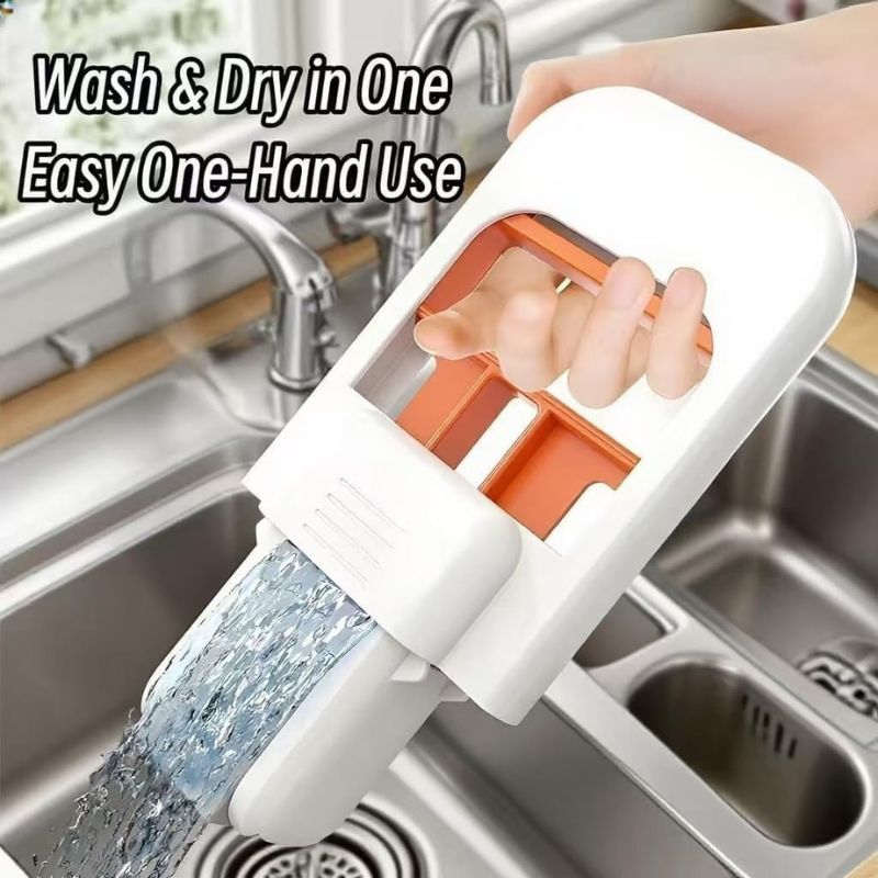 Hand operating self-squeezing mini mop to remove water over a kitchen sink